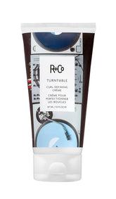 R+Co TURNTABLE bottle shows sleek packaging for easy curl styling