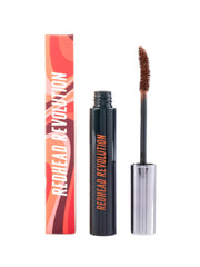 Redhead Revolution Gingerlash wand applying mascara for length and volume in a single stroke.