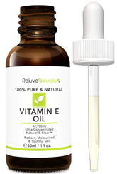 RejuveNaturals Vitamin E Oil bottle close-up showing pure, lightweight skin nourishment