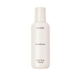 REVERIE Natural Nourishing Conditioner bottle delivering weightless hydration.