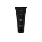 REVERIE Natural Rake Styling Balm bottle closeup for nourishing shine and lightweight hold.