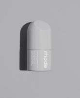 Rhode peptide glazing fluid bottle closeup in white packaging for luminous skin