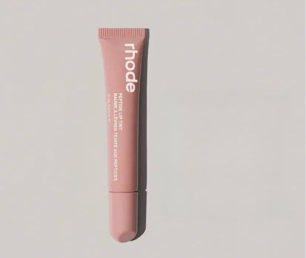 Rhode Lip Tint Toast Rose Taupe delivers sheer color with glossy finish and lip hydration.