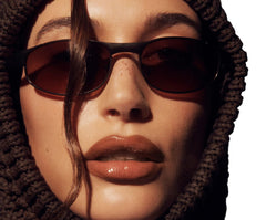 Rhode Peptide Lip Tint Espresso in hand shows hydrating color on the go.