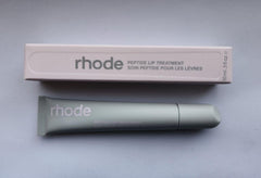 Rhode Watermelon Slice Lip Treatment tube delivering nourishing hydration for soft, glossy lips.