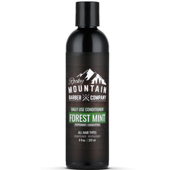 Rocky Mountain Barber Company conditioner bottle pour highlights refreshing tea tree infusion for hydrated hair.