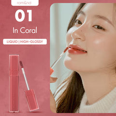 rom&nd dewyful water tint 01 coral swatch on lips highlights hydrating shine.