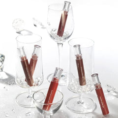 rom&nd Massive Lip Oil on lips displays natural glow and softened edges.