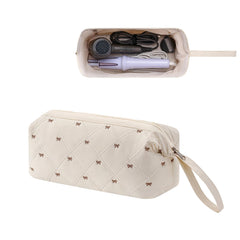 RSRSLEII hair tools travel bag front view with quilted beige waterproof exterior for organized travel.