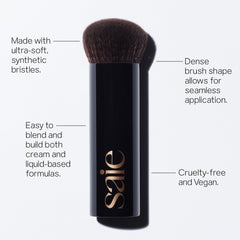 Saie The Big Liquid Foundation Brush applying product with even strokes on cheekbones