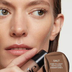 Saie Dew Bronze applicator closeup highlights precise, fool-proof application for targeted bronze.