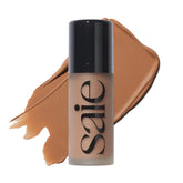Saie Dew Bronze liquid bronzer application on cheek for precise sun-kissed glow