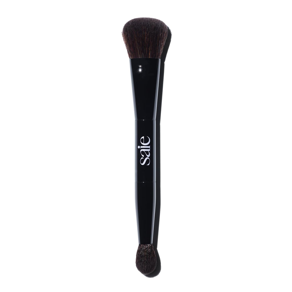 Saie The Double Brush large end for precise sculpting on cheekbones.