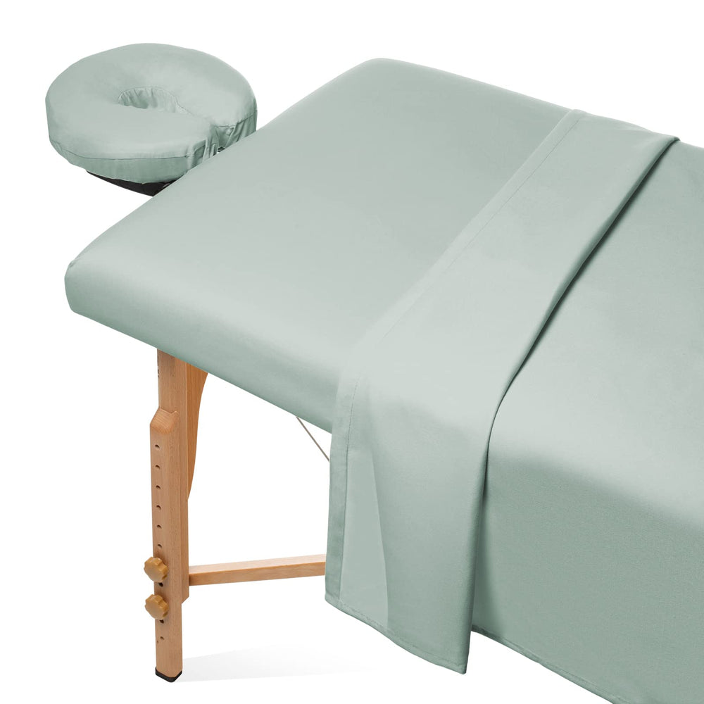 Saloniture seafoam flat sheet on massage table for a smooth, professional setup.