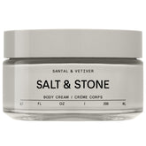 Salt & Stone Body Cream Santal & Vetiver bottle pouring rich hydration.