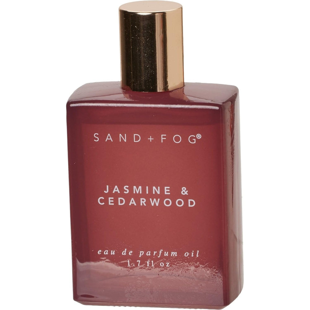 Sand and Fog Jasmine & Cedarwood perfume oil bottle—portable luxury with long-lasting scent.