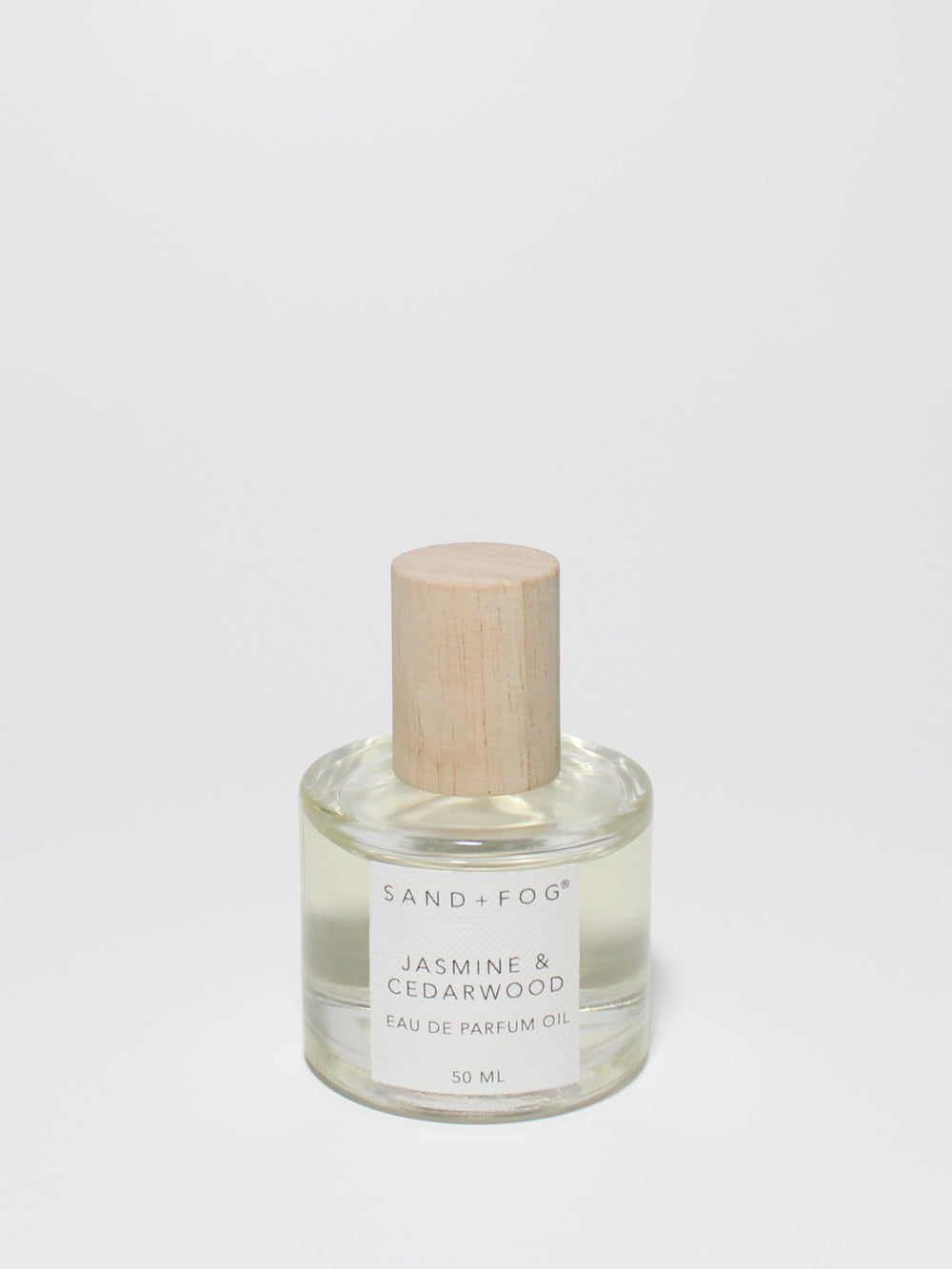 Sand + Fog Jasmine Cedarwood rollerball bottle delivers long-lasting fragrance.