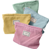 Sanwuta Macaron Series corduroy makeup bag showing organized cosmetics for travel
