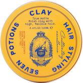 Seven Potions hair clay bottle closeup highlights high hold and matte finish for versatile styling.
