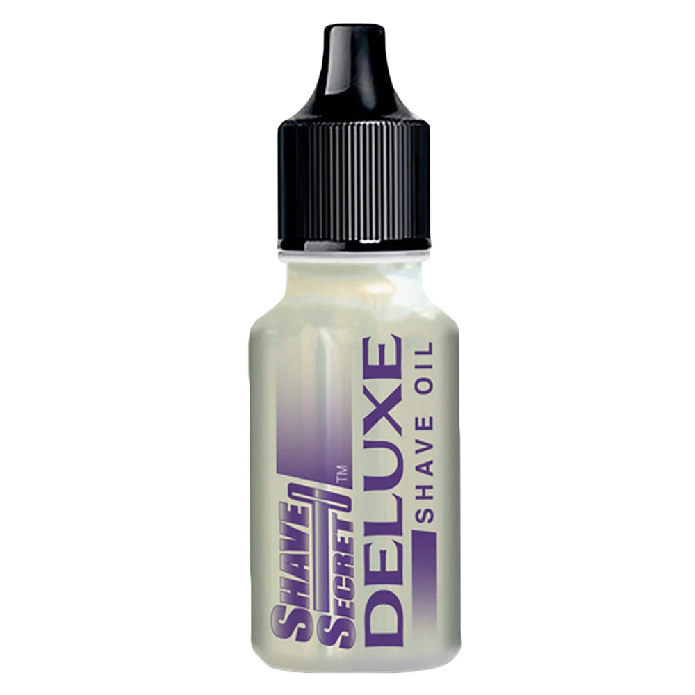 Shave Secret Deluxe oil bottle pouring for smooth glide and hydration.