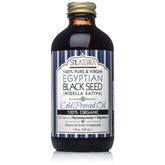 Shea Terra Egyptian Black Seed Oil bottle pour for skin and hair care.