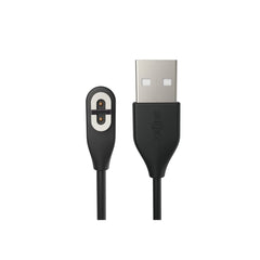 SHOKZ magnetic charger closeup shows quick-magnet alignment for OpenRun Pro charging