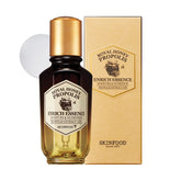 Skinfood 1957 royal honey propolis essence bottle glows with moisturizing radiance