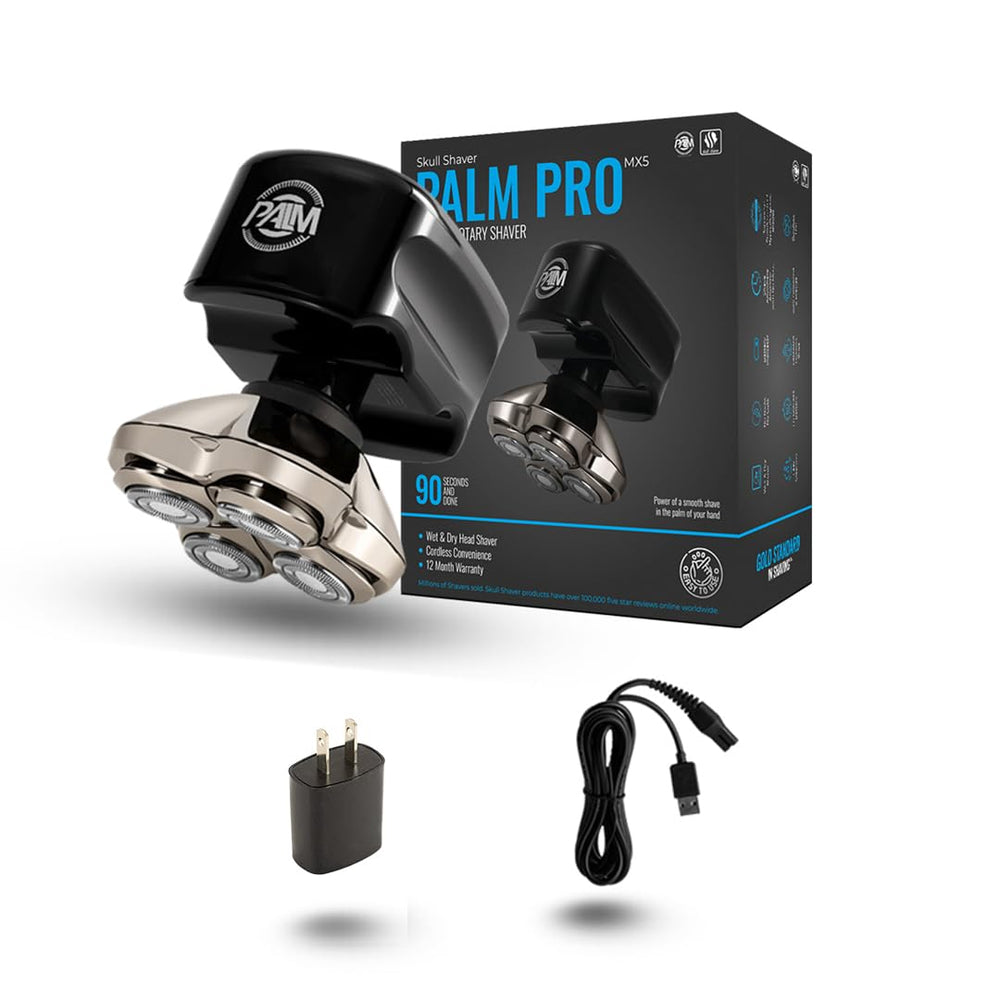 Skull Shaver Palm MX5 shaver in hand for on-the-go grooming.