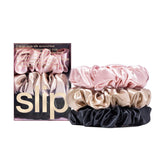 SLIP Large Scrunchie Multi pink close-up shows luxurious silk for gentle hair care.