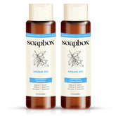 Soapbox Argan Shampoo bottle showcases frizz control and gentle cleansing for daily styling.