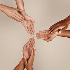 Hand holding 50 fl oz Softsoap for scale demonstrates large-volume refill convenience benefit