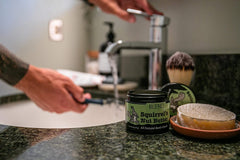 Squirrel's Nut Butter tub label closeup shows natural ingredients for sensitive skin.