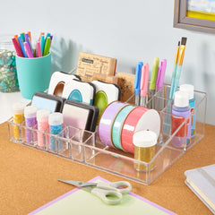 STORi Audrey clear vanity organizer filled with brushes on a dresser keeps makeup within reach.