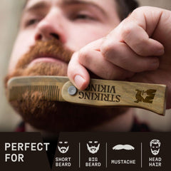 Striking Viking sandalwood comb with oil, helps evenly distribute product.