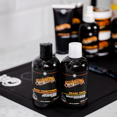 Suavecito Beard Wash lather shown during application for thorough cleansing.