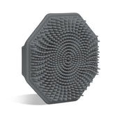 Sud Scrub Charcoal face scrubber demonstrates gentle exfoliation on sensitive skin with silicone design