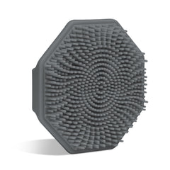 Sud Scrub Charcoal face scrubber demonstrates gentle exfoliation on sensitive skin with silicone design