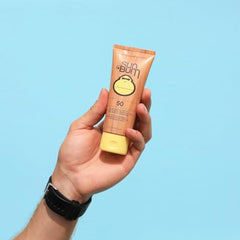 Sun Bum bottle close-up texture showing moisturizing, non-greasy finish for all skin types.