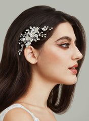 SWEETV crystal-embellished hair comb closeup showcases gleaming stones and delicate silver petals for bridal photos.