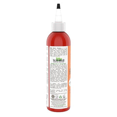 Taliah Waajid African Healing Oyl bottle dispensed for scalp care.