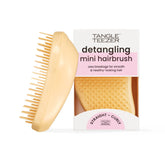 Tangle Teezer Original Detangler buttercup-yellow front view shows portable brush for on-the-go detangling.