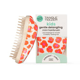 Tangle Teezer Original Detangler Mini in hand for quick on-the-go detangling