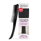 Tangle Teezer Ultimate Detangler brush on wet hair for knot-free detangling.