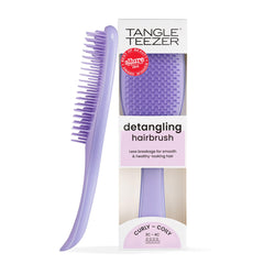 Tangle Teezer Ultimate Detangler close-up showing firm-flex teeth detangling thick curls
