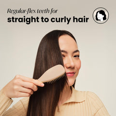Tangle Teezer Ultimate Detangler knot-removal close-up showing long teeth smoothing frizz-prone hair