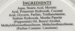 Taylor of Old Bond Street Peppermint Shave Cream packaging closeup highlights premium grooming quality.