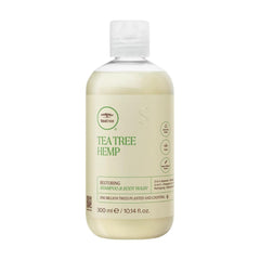 Tea Tree Hemp Restoring Shampoo bottle front, an all-in-one cleanser for hair and skin.