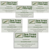 Tea Tree Therapy bar soap with eucalyptus packaging showcases vegan formula for gentle cleansing.