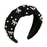 TEBIEKOY cute knotted headband with pink pearls adds elegant charm to any look.