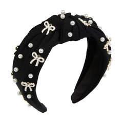 TEBIEKOY cute knotted headband with pink pearls adds elegant charm to any look.